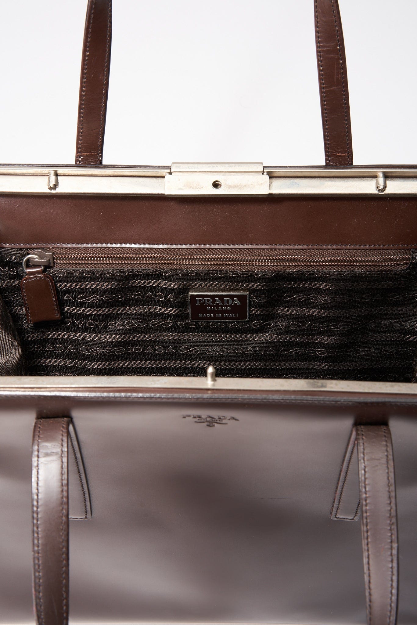 A vintage 90's Prada Brown Leather Shoulder Bag with Hard Frame