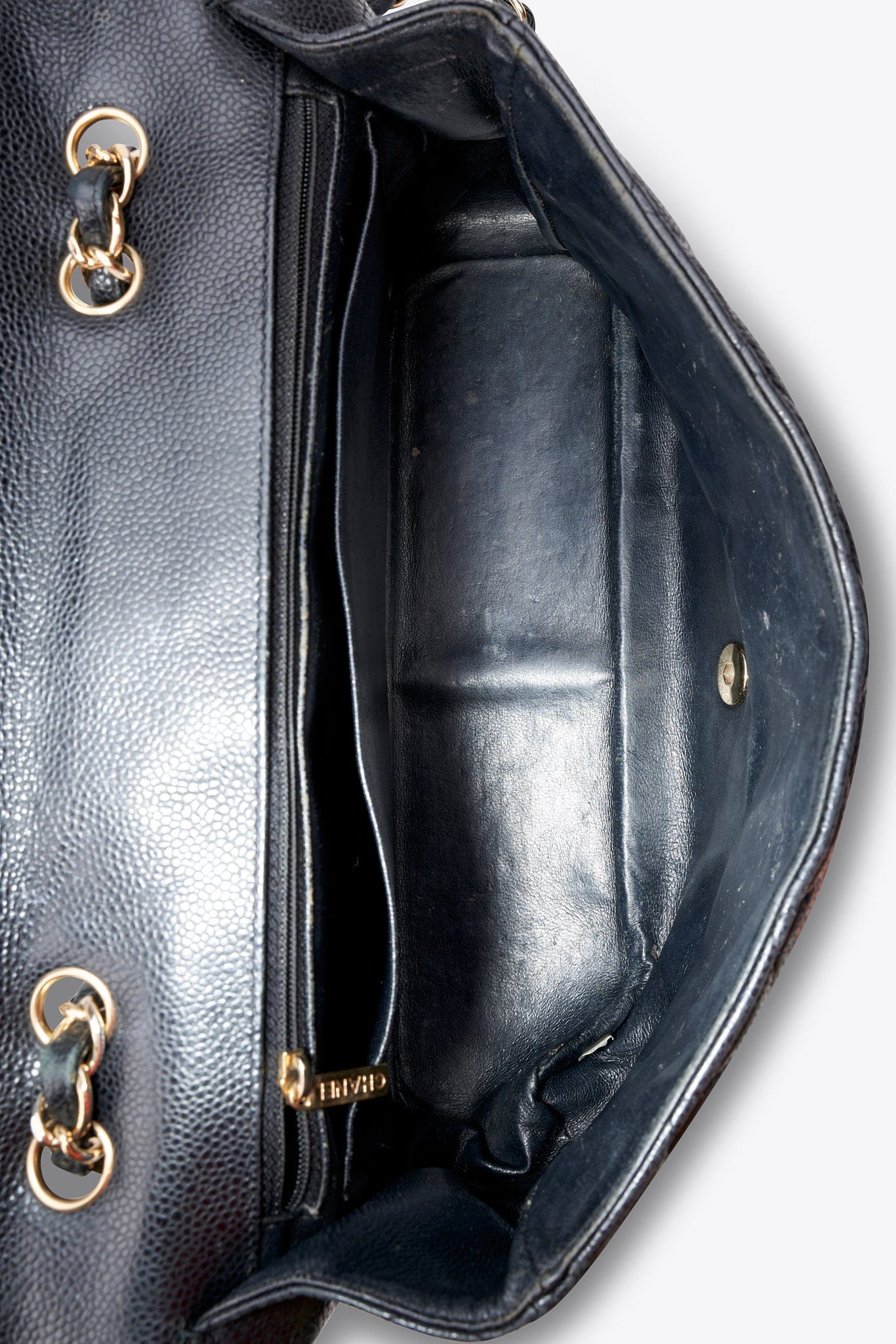 Chanel Classic Flap Bag in Black Caviar Leather with Gold Tone Hardware