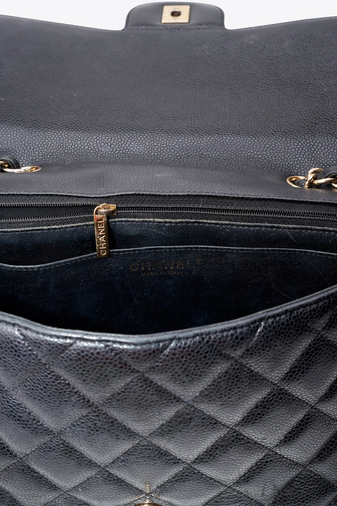 Chanel Classic Flap Bag in Black Caviar Leather with Gold Tone Hardware