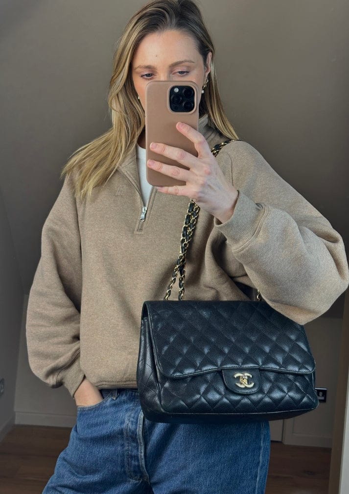 Chanel Classic Flap Bag in Black Caviar Leather with Gold Tone Hardware